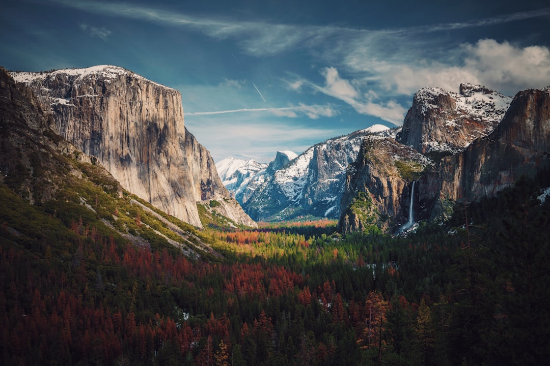 I think the best time to visit Yosemite is February. There is still some snow around the valley. The trees and the snow shine mystically because of the sun rays through the patchy clouds. Certainly a sight to behold. by Dream and Meaning photo of valley