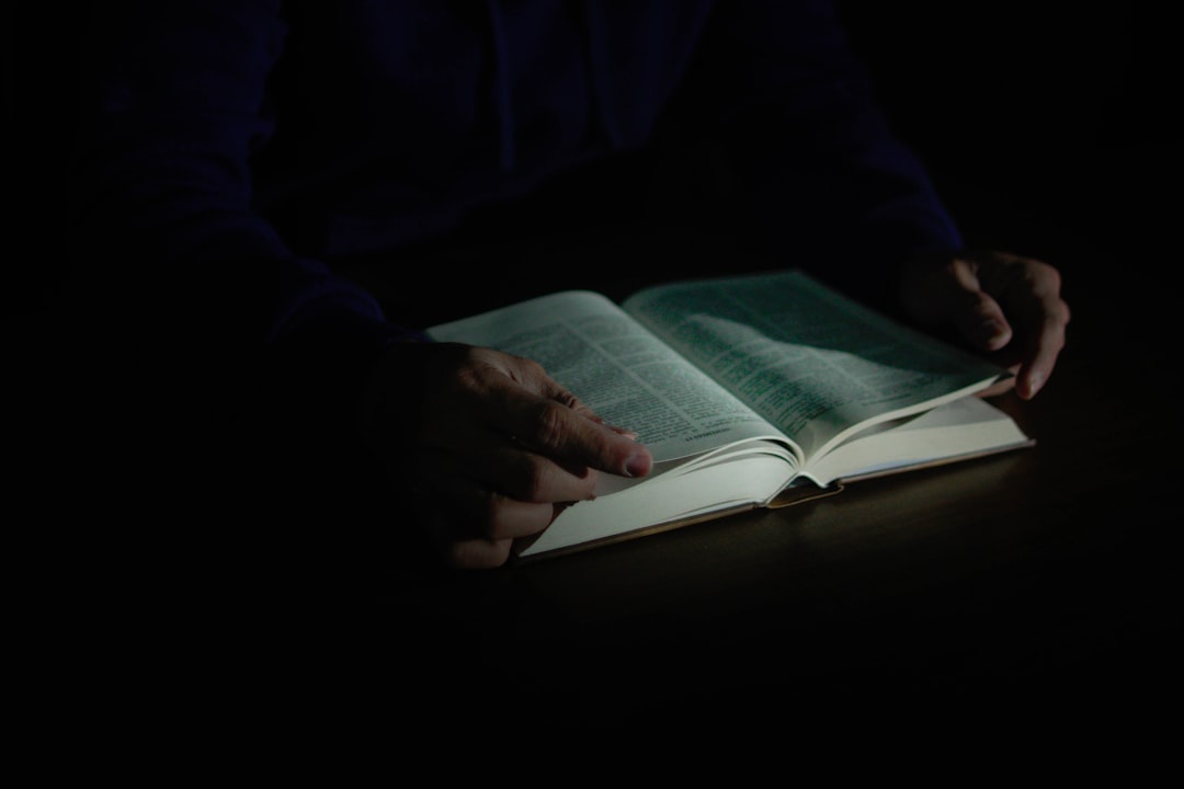 Biblical dream interpretation a to z by Dream and Meaning a person is reading a book in the dark