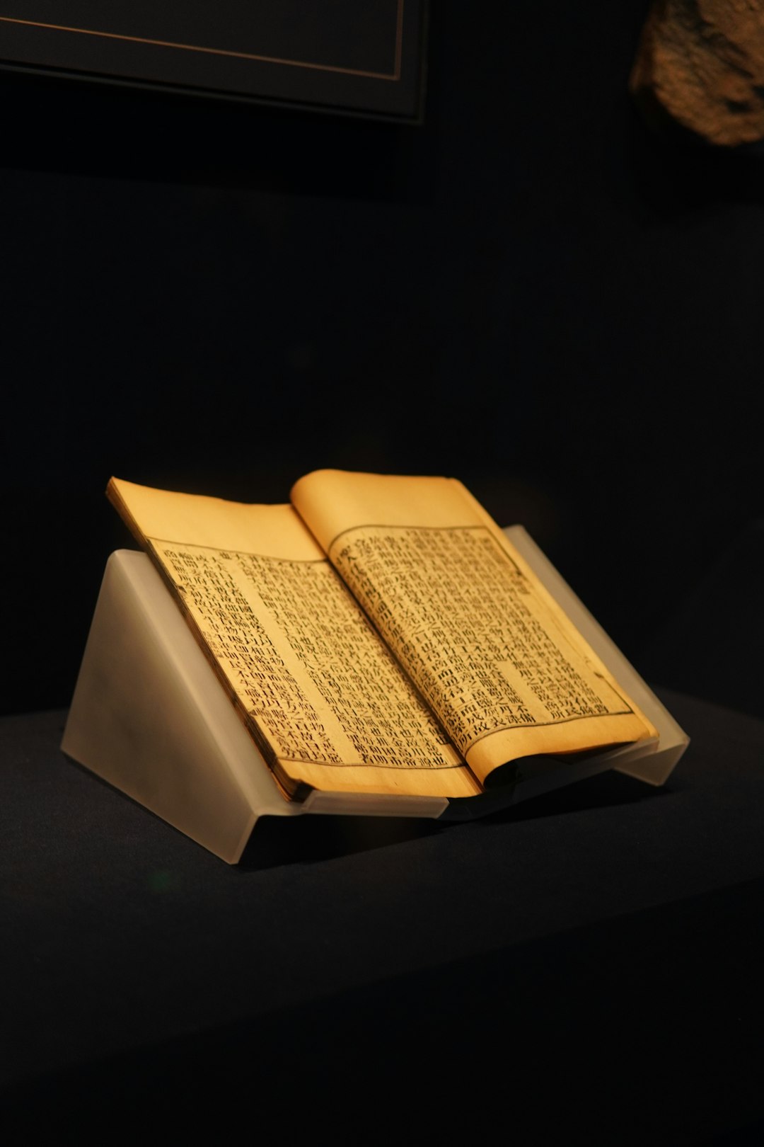 📜 Unveiling Ancient Wisdom: The Rich History of Biblical Dream Interpretation by Dream and Meaning An open, old book rests on a display stand.
